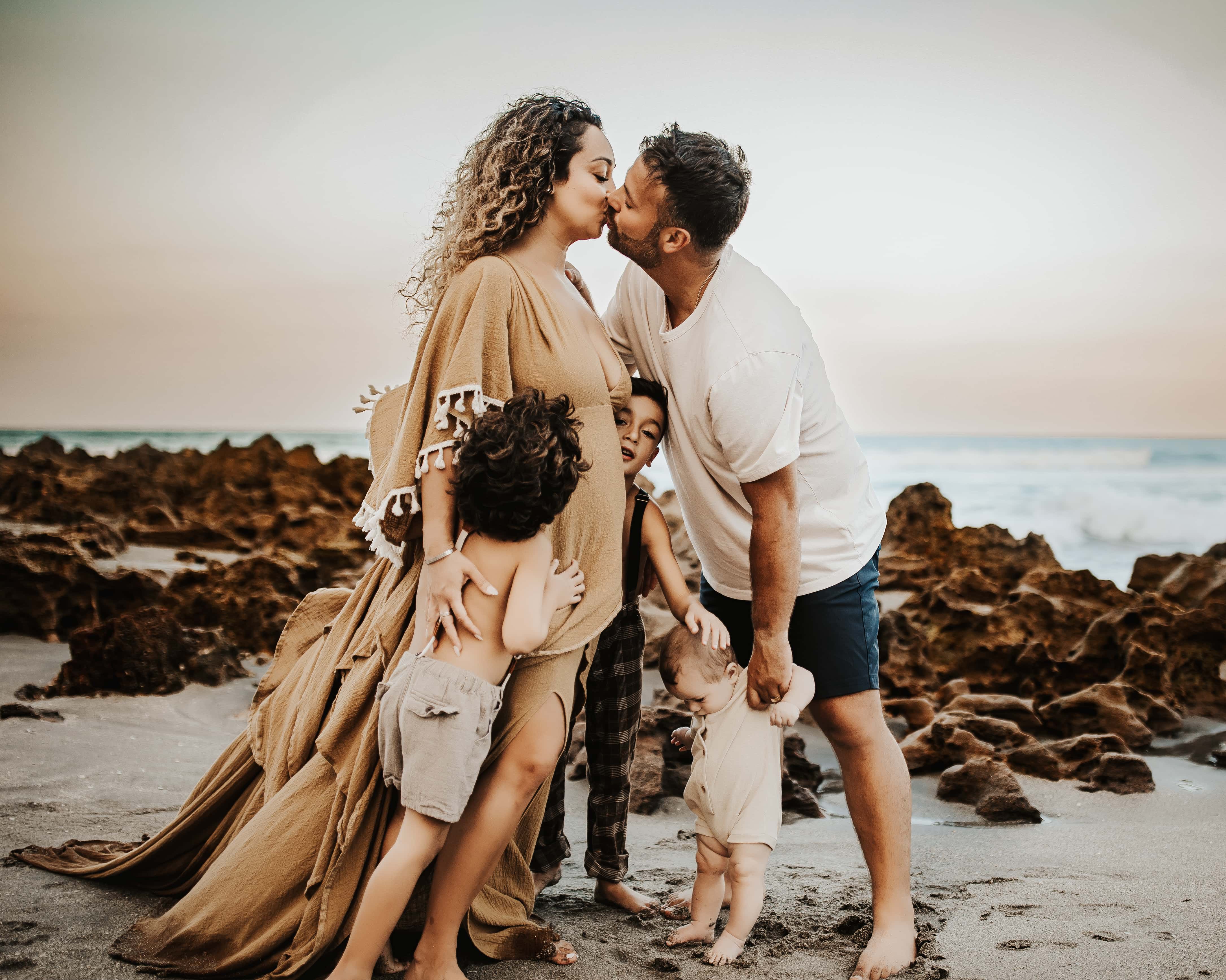 family in palm beach kissing